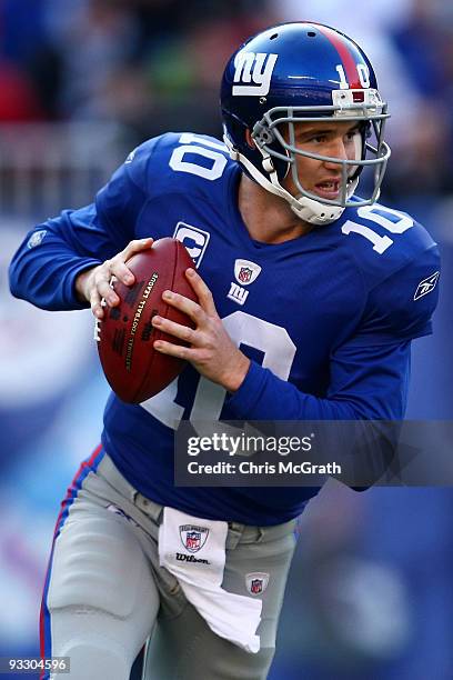 Eli Manning of the the New York Giants looks to pass against the Atlanta Falcons on November 22, 2009 at Giants Stadium in East Rutherford, New...