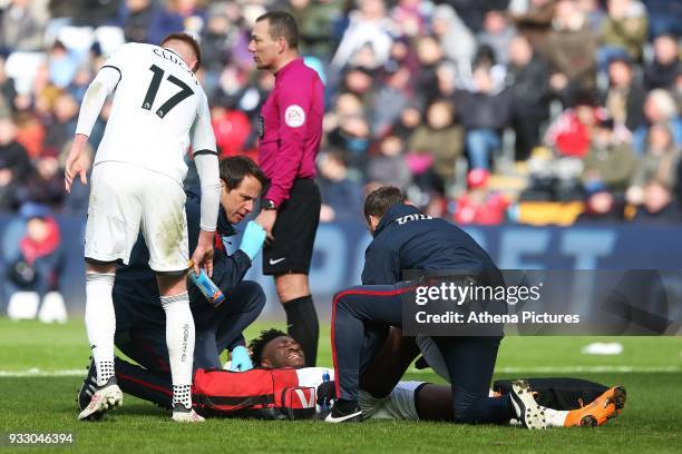 Tammy Abraham of Swansea receives treatment for an injury during the Fly Emirates FA Cup Quarter Final match between Swansea City and Tottenham...