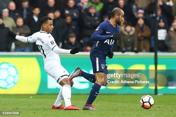 Luciano Narsingh of Swansea challenges Lucas Moura of Tottenham during the Fly Emirates FA Cup Quarter Final match between Swansea City and Tottenham...