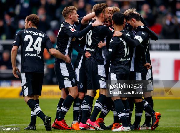 Lars Stindl of Moenchengladbach celebrates with team mates after scoring his teams seconds goal during the Bundesliga match between Borussia...