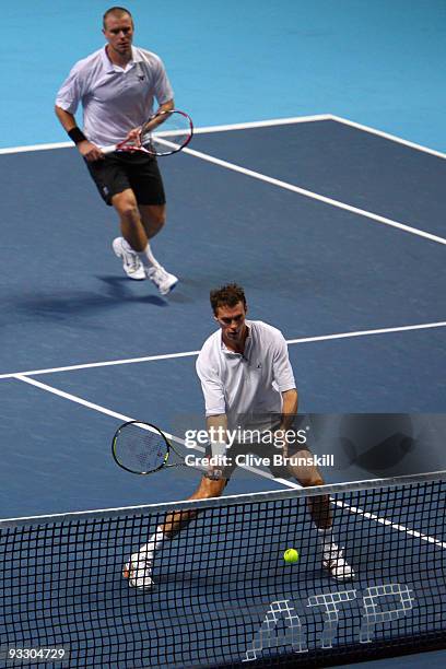 Frantisek Cermak of Czech Republic returns the ball playing with Michal Mertinak of Slovakia during the men's doubles first round match against...