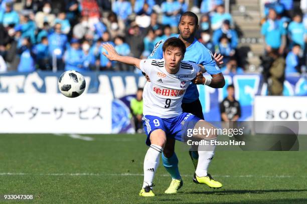 Atsushi Kawata of Albirex Niigata and Calvin Jong A Pin of Yokohama FC compete for the ball during the J.League J2 match between Yokohama FC and...