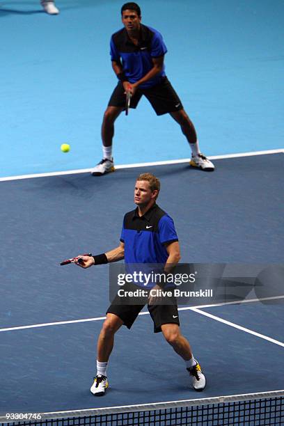 Mark Knowles of The Bahamas returns the ball playing with Mahesh Bhupathi of India during the men's doubles first round match against Frantisek...