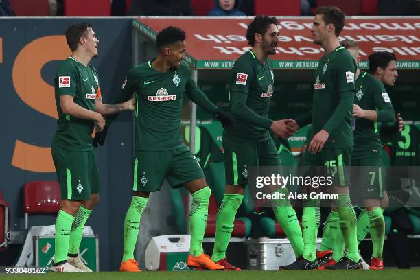 Max Kruse of Bremen celebrates with his team after he scored a goal to make it 1:3 during the Bundesliga match between FC Augsburg and SV Werder...