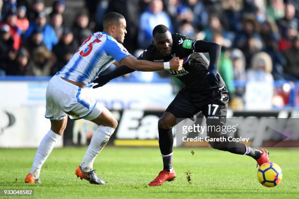 Mathias Jorgensen of Huddersfield Town and Christian Benteke of Crystal Palace battle for the ball during the Premier League match between...