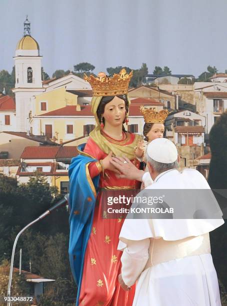 Pope Francis prays near a statue of the virgin Mary during his one hour visit in Pietrelcina the birthplace of San Pio, one of saint most follows in...