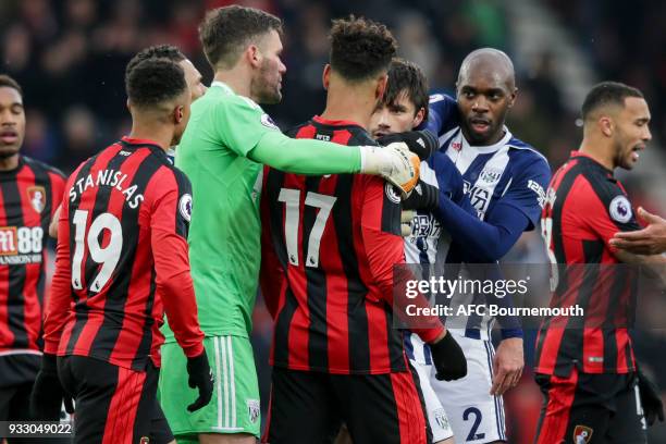 Joshua King of Bournemouth and Claudio Yacob of West Bromwich Albion have to be kept apart after Yacob's challenge on Adam Smith of Bournemouth...