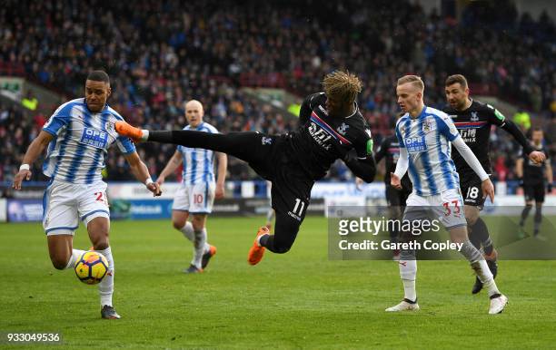Wilfried Zaha of Crystal Palace attempts a volley during the Premier League match between Huddersfield Town and Crystal Palace at John Smith's...