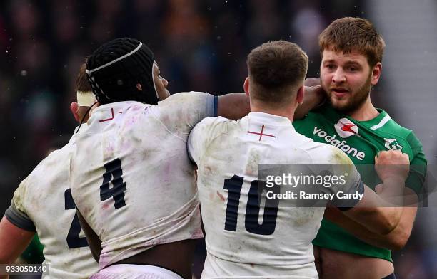 London , United Kingdom - 17 March 2018; Iain Henderson of Ireland tussles with Maro Itoje, left, and Owen Farrell of England during the NatWest Six...