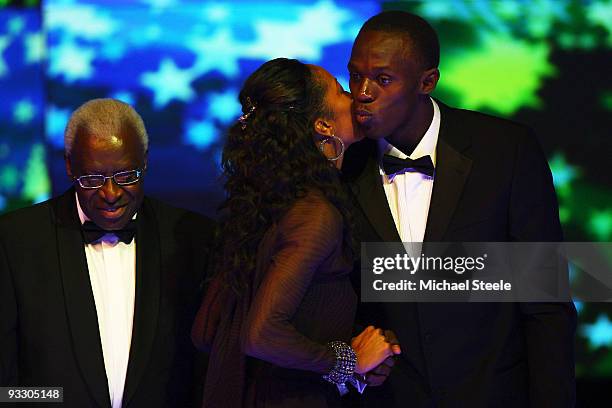 World and Olympic Sprint Champion Usain Bolt winner of the male athlete of the year kisses 400m World Champion and 4×400m Olympic Champion Sanya...