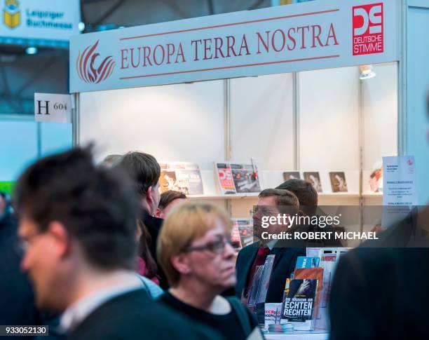 Peter Schreiber, editor in chief of the "Deutsche Stimme" newspaper close to Germany's far-right NPD party, stands at his booth at the Leipzig Book...