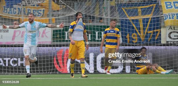 Andrea La Mantia of Virtus Entella celebrates after scoring the opening goal and Gianni Munari of Parma Calcio 1913 reacts during the serie B match...