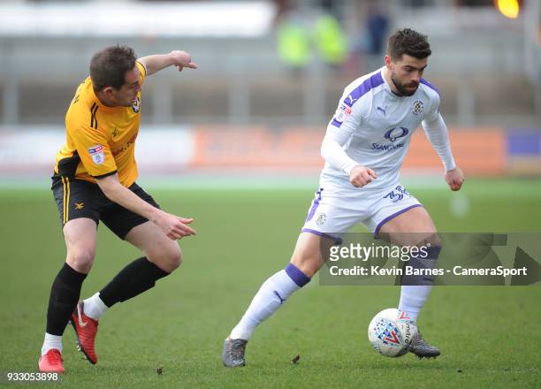Luton Town's Elliot Lee under pressure from Newport County's Matt Dolan during the Sky Bet League Two match betweenNewport County and Luton Town at...