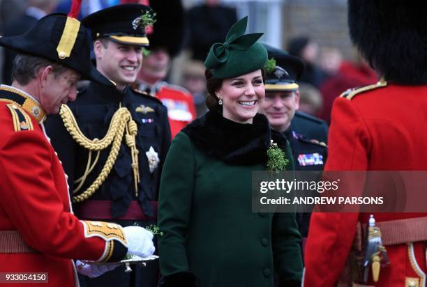 Britain's Prince William, Duke of Cambridge, and Britain's Catherine, Duchess of Cambridge, attend the St. Patrick's Day Parade with the 1st...