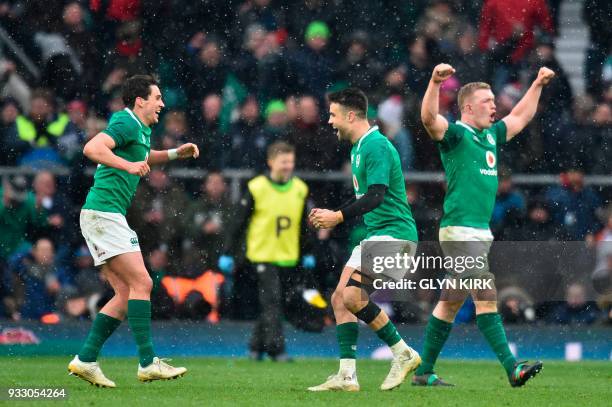 Ireland's scrum-half Conor Murray and Ireland's Joey Carbery celebrate their victory at the end of their Six Nations international rugby union match...