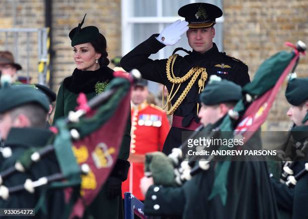 Britain's Prince William, Duke of Cambridge, and Britain's Catherine, Duchess of Cambridge, attend the St. Patrick's Day Parade with the 1st...