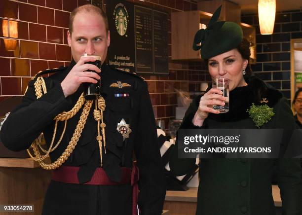 Britain's Prince William, Duke of Cambridge, and Britain's Catherine, Duchess of Cambridge, drink a toast as they attend the St. Patrick's Day Parade...