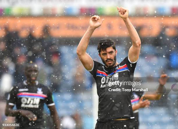 James Tomkins of Crystal Palace celebrates his side's win following the Premier League match between Huddersfield Town and Crystal Palace at John...
