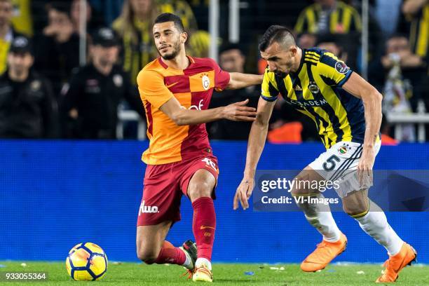 Younes Belhanda of Galatasaray SK, Mehmet Topal of Fenerbahce SK during the Turkish Spor Toto Super Lig match Fenerbahce AS and Galatasaray AS at the...