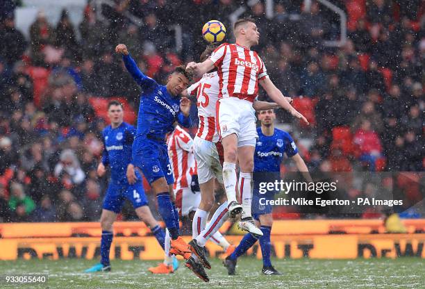 Everton's Mason Holgate battles for the ball with Stoke City's Ryan Shawcross during the Premier League match at the bet365 Stadium, Stoke.