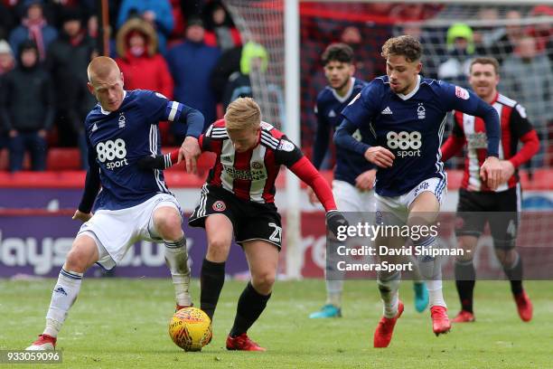 Nottingham Forest's Ben Watson battles with Sheffield United's Mark Duffy during the Sky Bet Championship match between Sheffield United and...