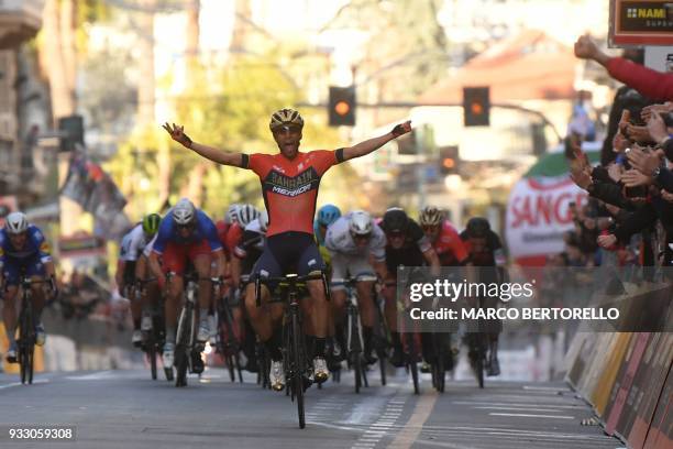 Italy's Vincenzo Nibali of team Bahrain celebrates as he crosses the finish line to win the 109th edition of the Milan - San Remo cycling race on...