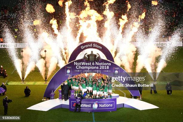 The Ireland team celebrate with the NatWest Six Nations trophy and the Triple Crown Trophy after the NatWest Six Nations match between England and...