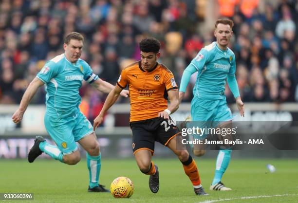 Liam Boyce and Tom Naylor of Burton Albion and Morgan Gibbs-White of Wolverhampton Wanderers during the Sky Bet Championship match between...