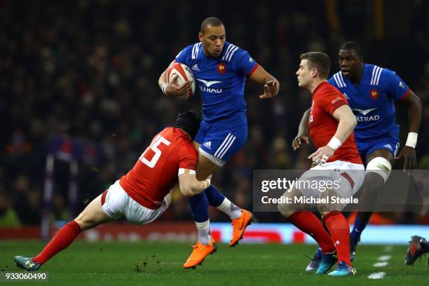 Gael Fickou of France is tackled by Leigh Halfpenny of Wales during the NatWest Six Nations match between Wales and France at Principality Stadium on...