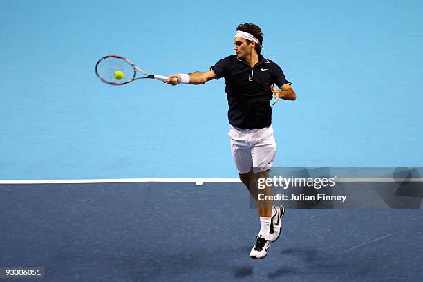 Roger Federer of Switzerland returns the ball during the men's singles first round match against Fernando Verdasco of Spain during the Barclays ATP...