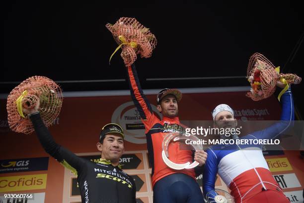 Italy's Vincenzo Nibali of team Bahrain, winner, poses on the podium with Australian Caleb Ewan of team Mitchelton Scott, second, and France's Arnaud...