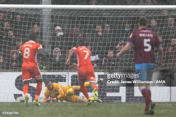 Dean Henderson of Shrewsbury Town saves the penalty of Josh Morris of Scunthorpe United during the Sky Bet League One match between Scunthorpe United...
