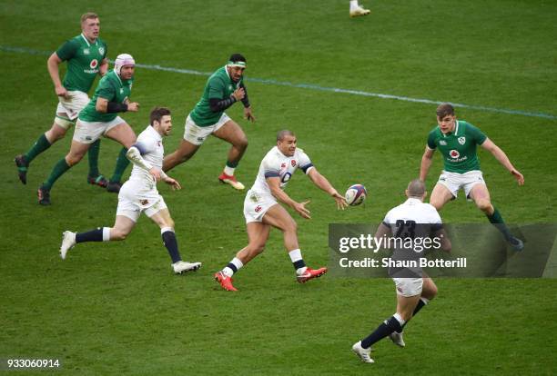 Jonathan Joseph of England passes the ball during the NatWest Six Nations match between England and Ireland at Twickenham Stadium on March 17, 2018...