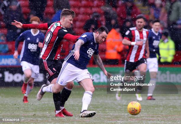 Nottingham Forest's Lee Tomlin gets away from Sheffield United's Lee Evans during the Sky Bet Championship match between Sheffield United and...