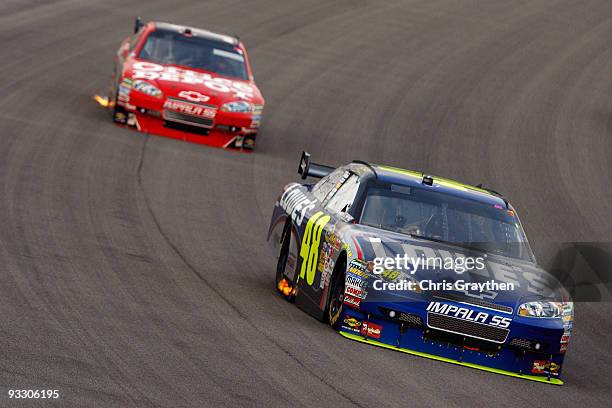 Jimmie Johnson, driver of the Lowe's Chevrolet, drives in front Juan Pablo Montoya, driver of the Target Chevrolet, during the NASCAR Sprint Cup...