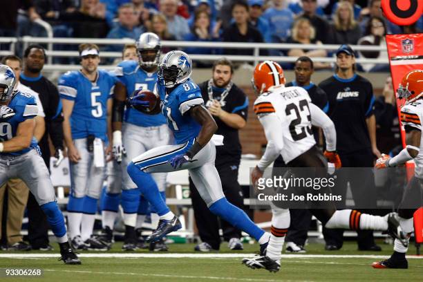 Calvin Johnson of the Detroit Lions runs with the football after catching a pass against the Cleveland Browns at Ford Field on November 22, 2009 in...