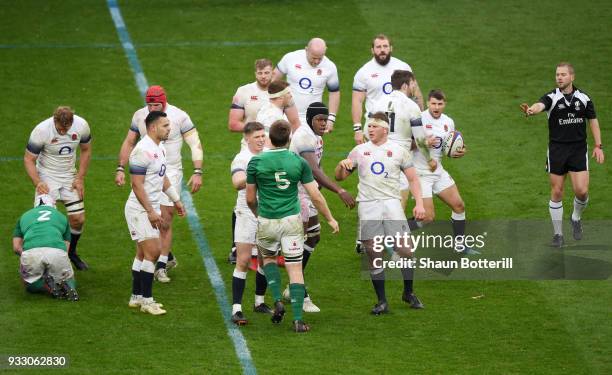 Owen Farrell and Dylan Hartley of England clash with Iain Henderson of Ireland during the NatWest Six Nations match between England and Ireland at...