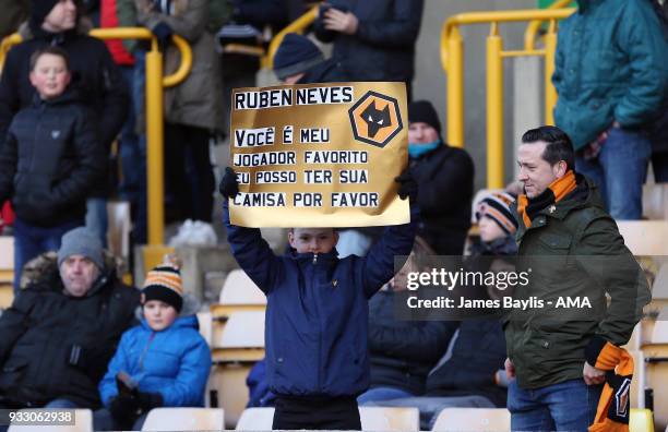 Young Wolves supporter with a banner for Ruben Neves of Wolverhampton Wanderers during the Sky Bet Championship match between Wolverhampton Wanderers...