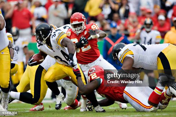 Running back Rashard Mendenhall of the Pittsburgh Steelers is tackled by the shirt by defensive end Glenn Dorsey of the Kansas City Chiefs at...