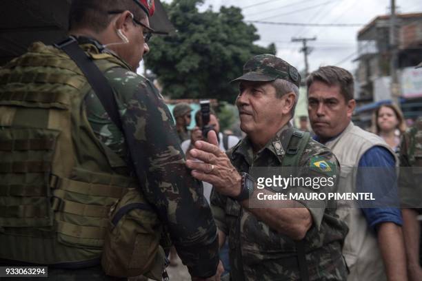 The leader of Rio's Security Federal Intervention General Walter Souza Braga Netto , is pictured during an operation at Vila Kennedy favela in Rio de...