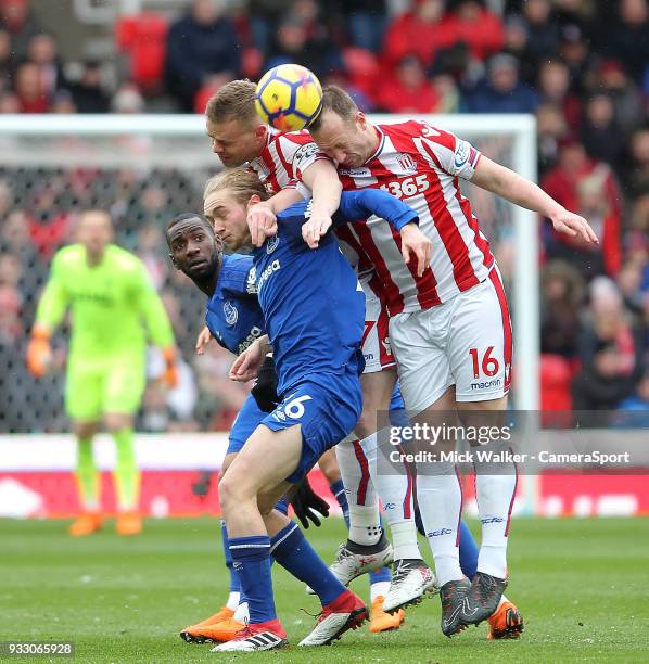 Stoke City's Ryan Shawcross and Charlie Adam in action with Everton's Tom Davies during the Premier League match between Stoke City and Everton at...