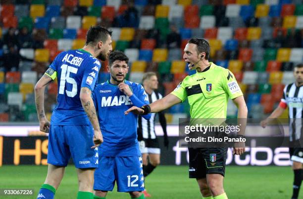 Referee Abisso reacts with Francesco Acerbi of Sassuolo during the serie A match between Udinese Calcio and US Sassuolo at Stadio Friuli on March 17,...
