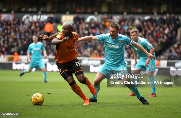 Wolverhampton Wanderers Benik Fobe is challenged by Burton Albion's Jake Buxton during the Sky Bet Championship match at Molineux, Wolverhampton.