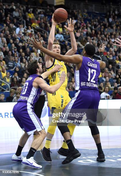 Michael Stockton of BG Goettingen, Niels Giffey of Alba Berlin and Darius Carter of BG Goettingen during the Basketball Bundesliga game between Alba...