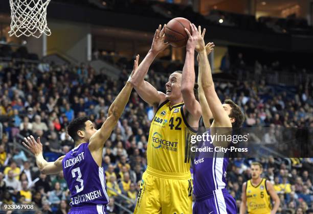 Dominic Lockhart of BG Goettingen, Dennis Clifford of Alba Berlin and Stephan Haukohl of BG Goettingen during the Basketball Bundesliga game between...