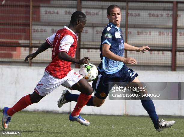 Ivory Coast's Yao Kouassi vies with Morocco's Rachid Housni during the CAF Champions league football match between Williamsville Athletic Club and...