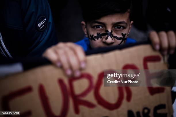 Refugees and migrants in Greece take part in a protest for the International Day for the Elimination of Racial Discrimination in Athens, on March 17,...