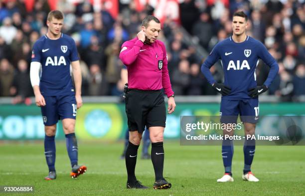 Referee Kevin Friend waits for the Video Assistant Referee system to rule if the goal from Tottenham Hotspur's Son Heung-Min is ruled offside during...