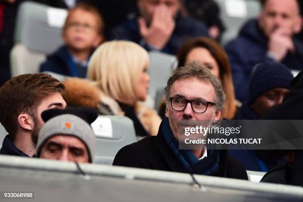 Paris Saint-Germain's and Bordeaux's former head coach Laurent Blanc looks on from the stands as he attends the French L1 football match between...