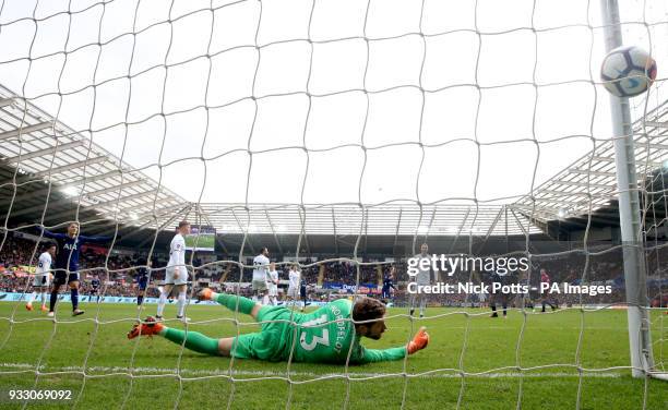 Swansea City goalkeeper Kristoffer Nordfeldt fails stop the ball as Tottenham Hotspur's Christian Eriksen scores his side's third goal of the game...